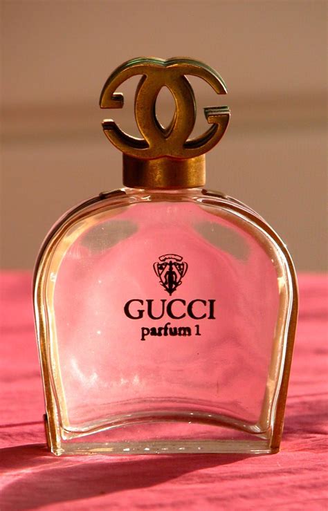 gucci perfume tall pink bottle.